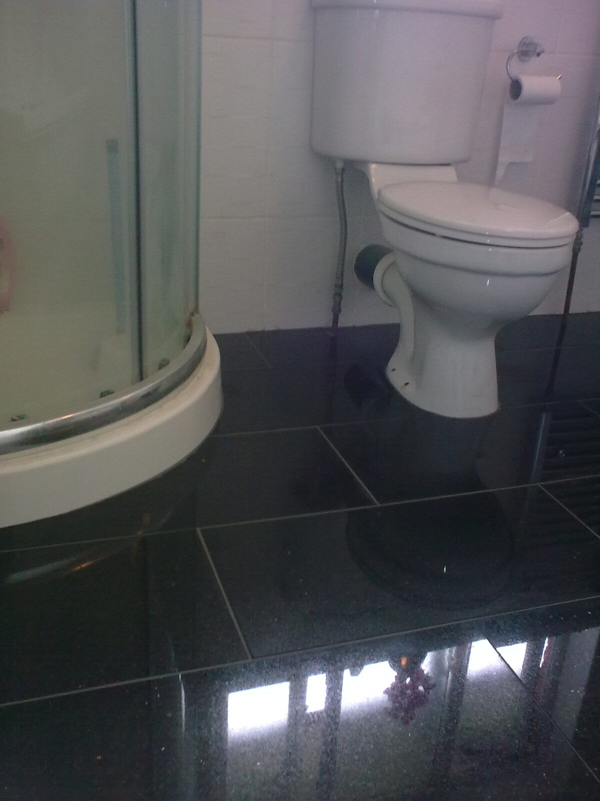 Tiled bathroom with mosaic border