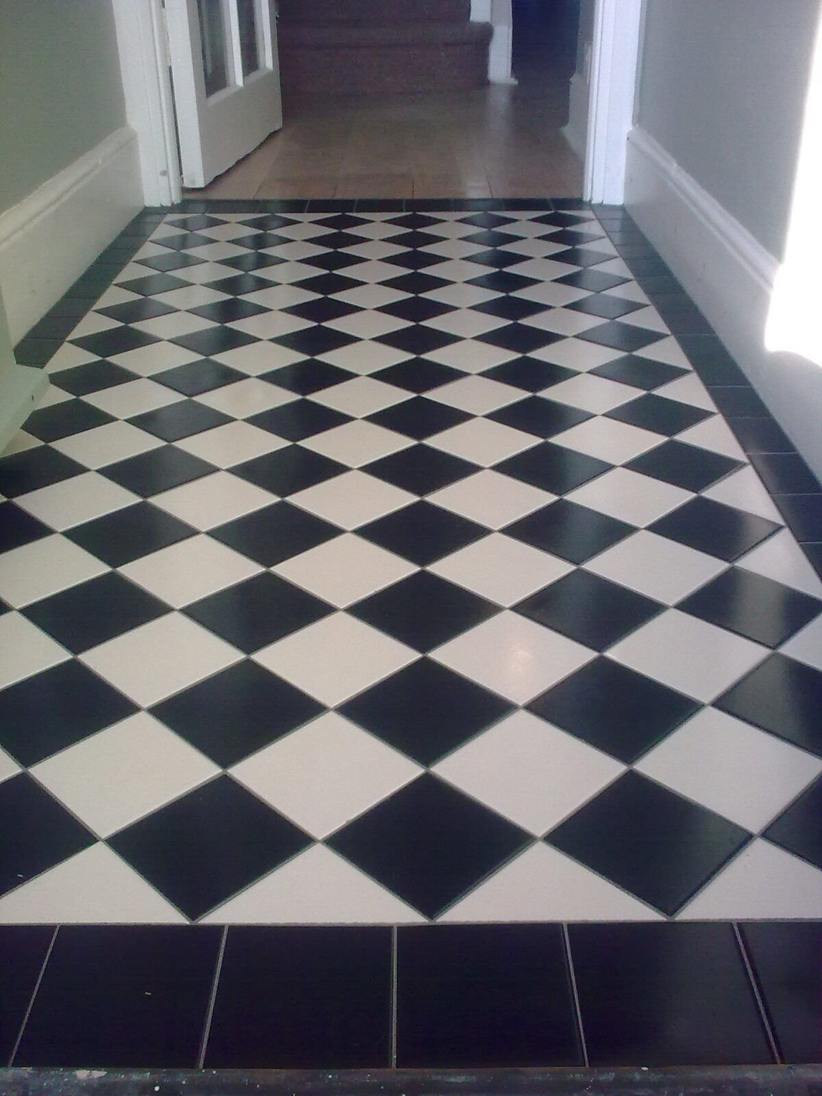 Chequerboard tiled floor with border