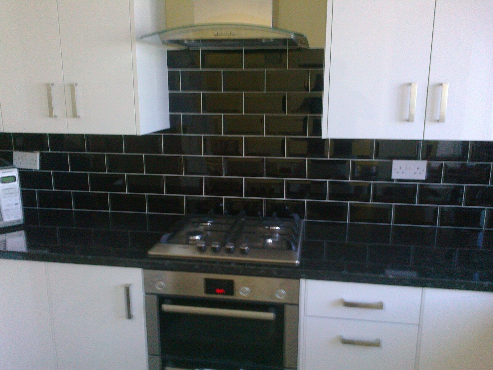 Tiled kitchen splashback and feature wall in Essex