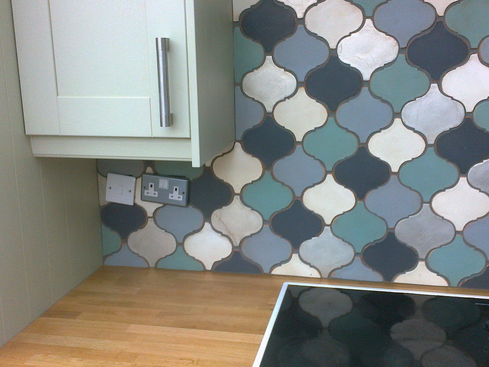 Tiled kitchen feature wall completed by G Perks Tiling Services in Essex